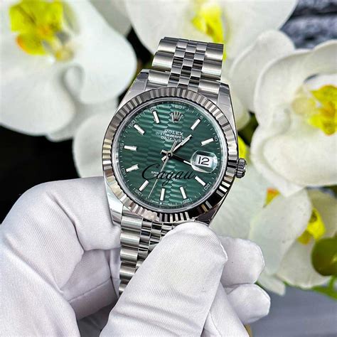 rolex motif dial green|Rolex with a green face.